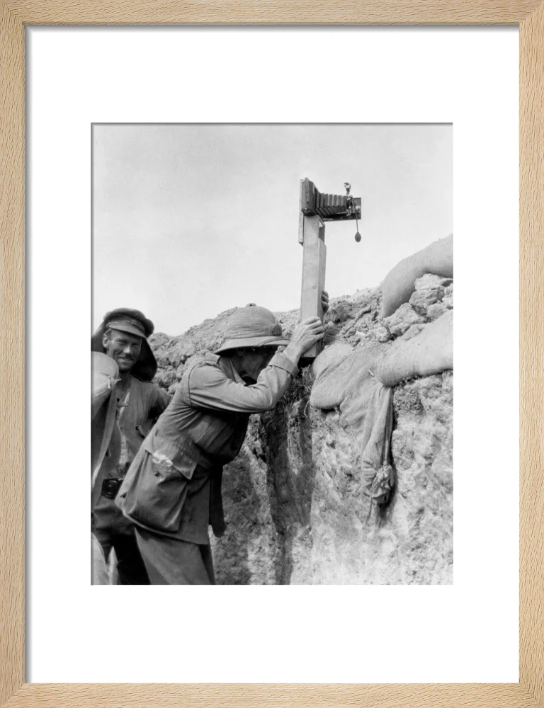 Soldier taking a photograph with a camera attached to a periscope, c 1915. - Image 11