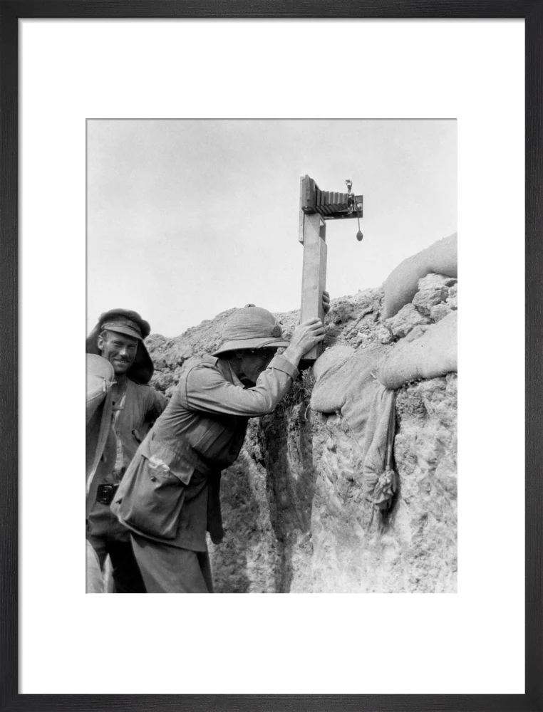 Soldier taking a photograph with a camera attached to a periscope, c 1915. - Image 13