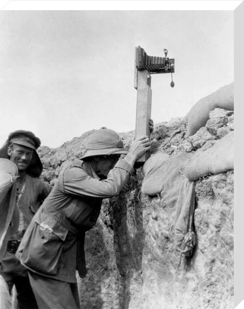 Soldier taking a photograph with a camera attached to a periscope, c 1915. - Image 33
