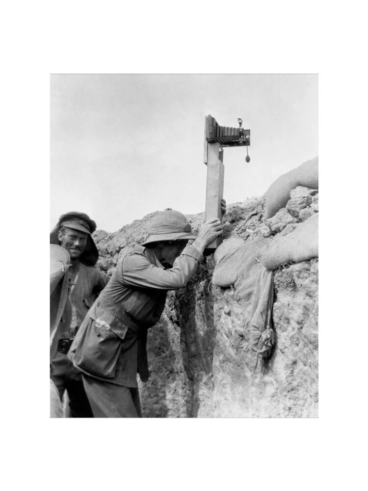 Soldier taking a photograph with a camera attached to a periscope, c 1915. - Image 50
