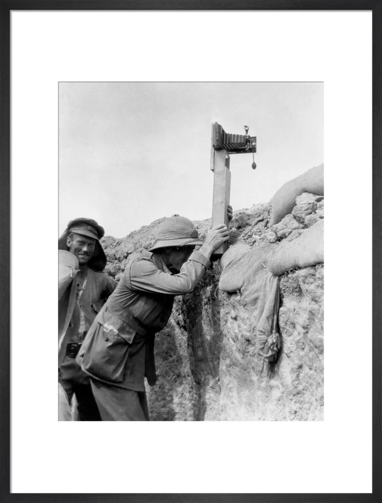 Soldier taking a photograph with a camera attached to a periscope, c 1915. - Image 51