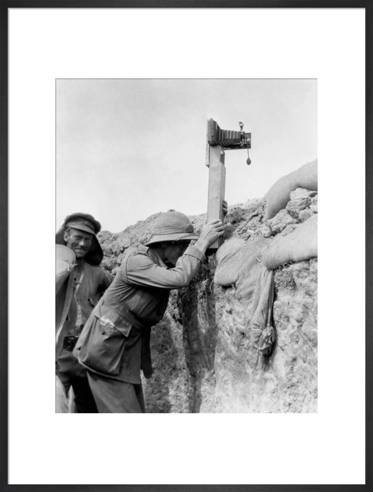 Soldier taking a photograph with a camera attached to a periscope, c 1915. - Image 56