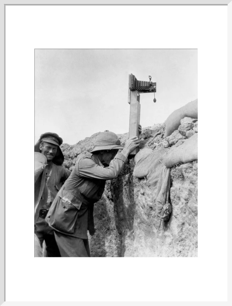 Soldier taking a photograph with a camera attached to a periscope, c 1915. - Image 57