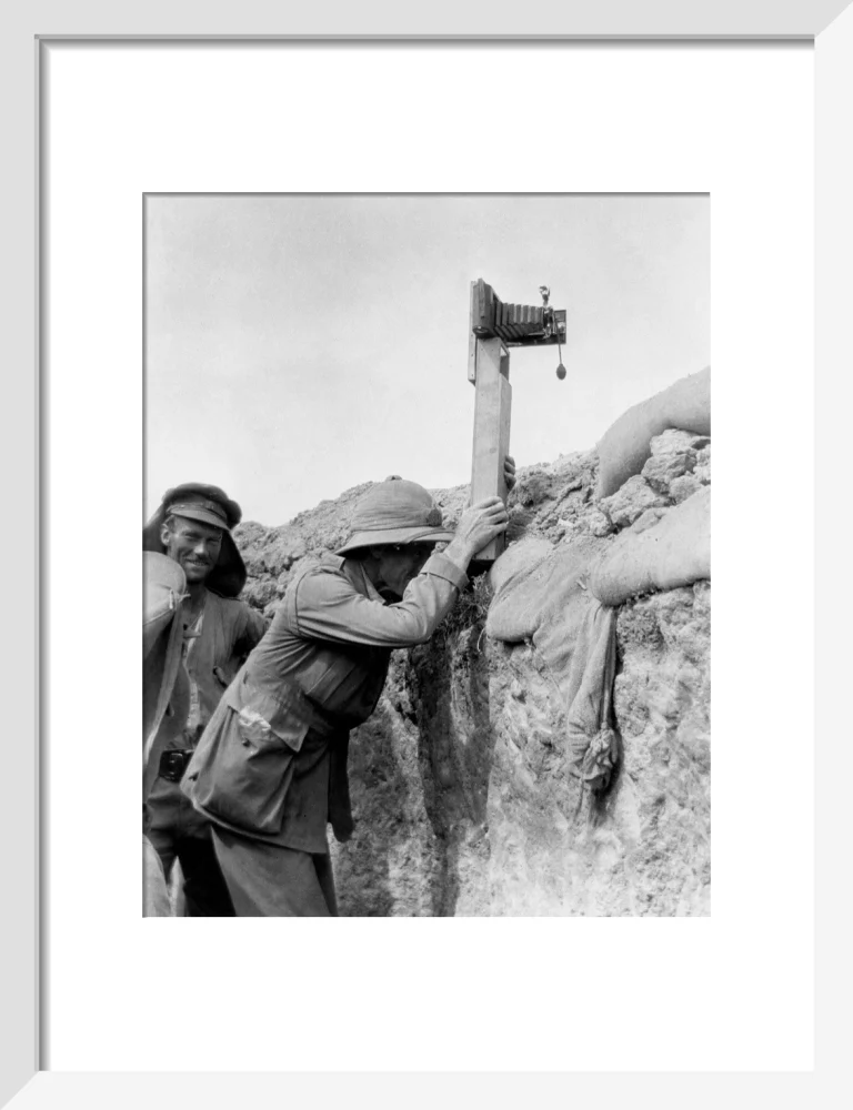 Soldier taking a photograph with a camera attached to a periscope, c 1915. - Image 9