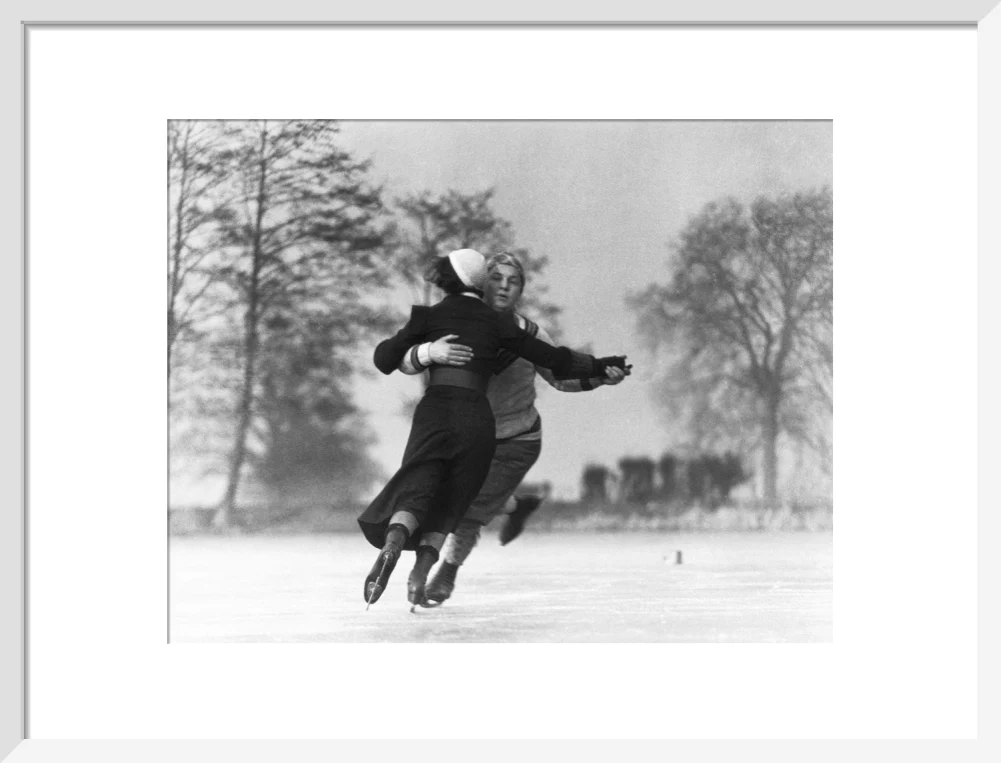 Couple skating on an ice rink, c 1930s. - Image 14