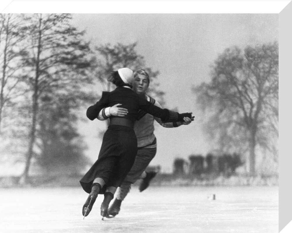 Couple skating on an ice rink, c 1930s. - Image 32