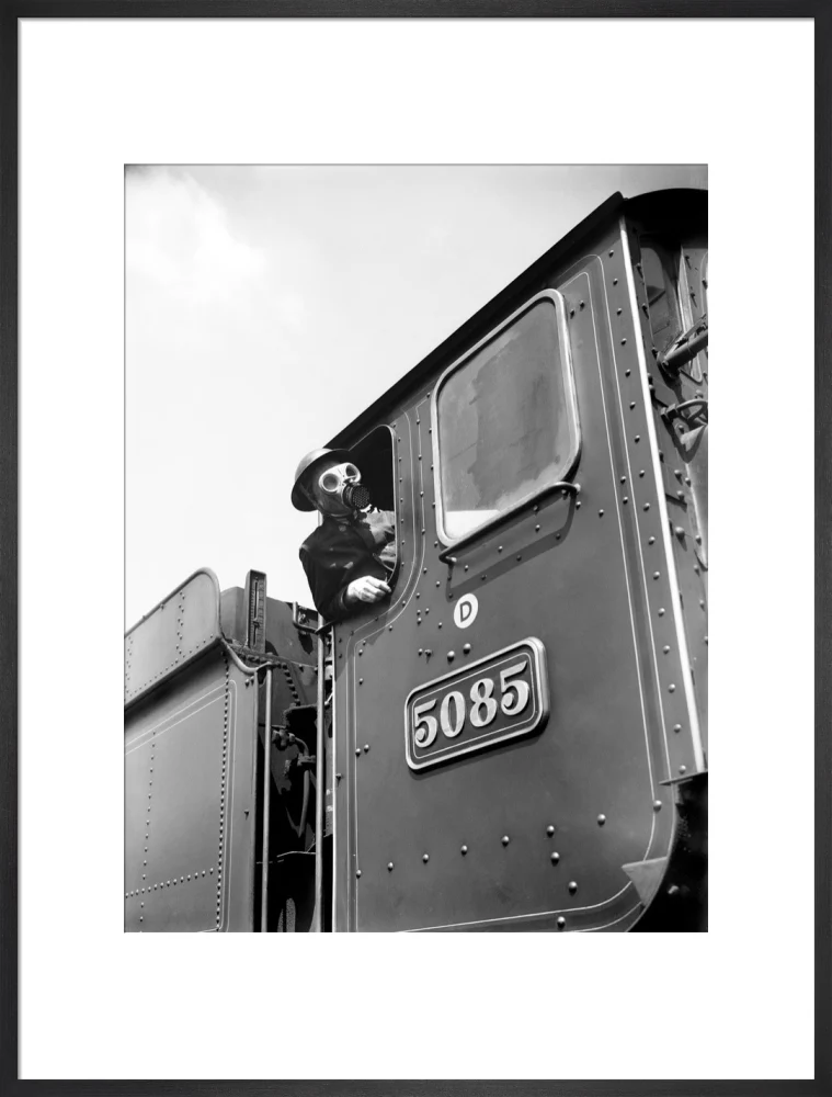 Train driver with a gas mask, World War Two, 21 August 1940. - Image 23