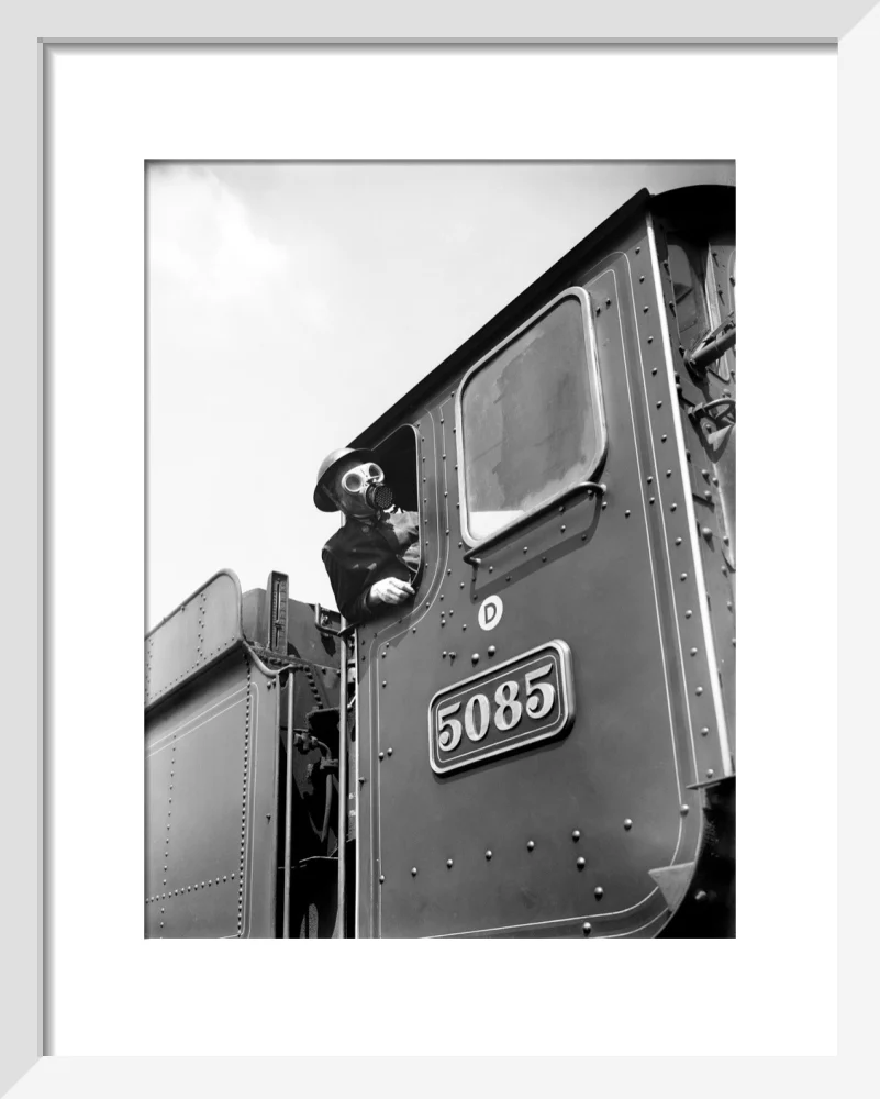 Train driver with a gas mask, World War Two, 21 August 1940. - Image 4