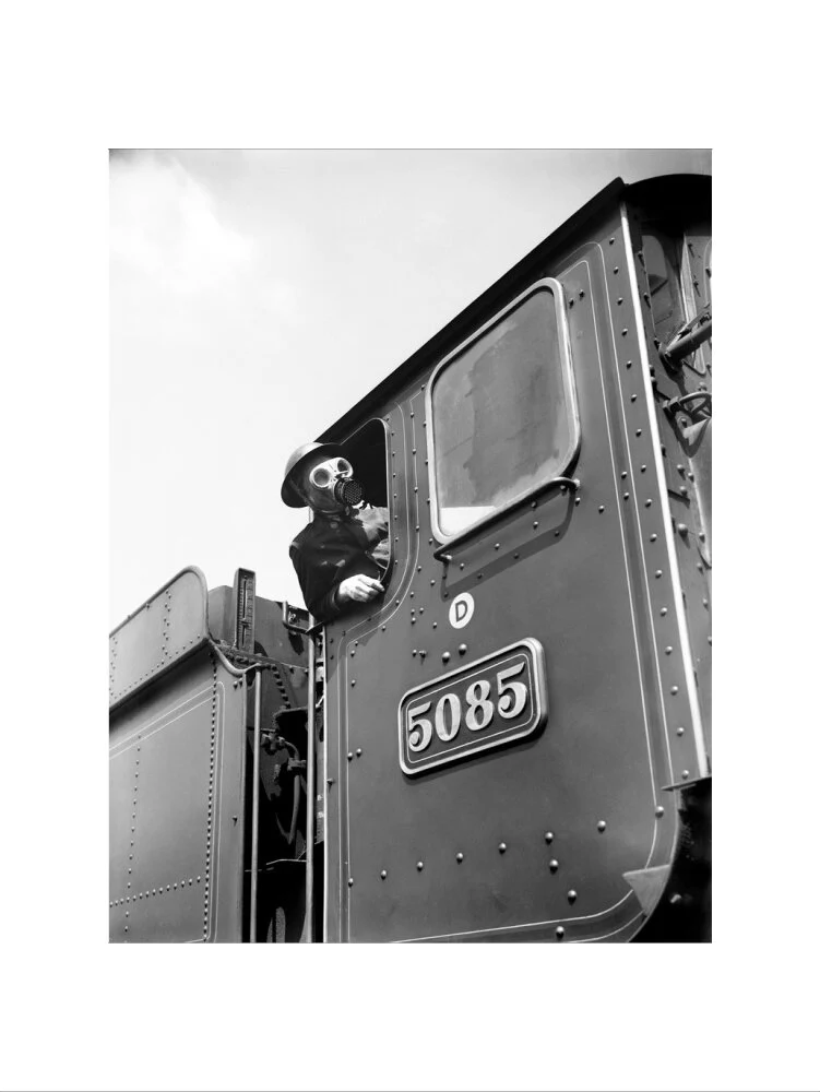 Train driver with a gas mask, World War Two, 21 August 1940. - Image 50
