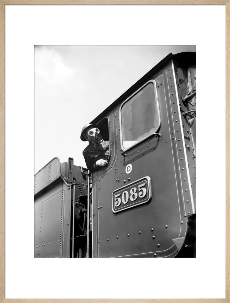 Train driver with a gas mask, World War Two, 21 August 1940. - Image 59