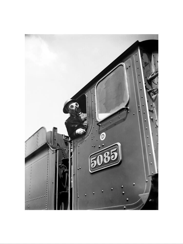 Train driver with a gas mask, World War Two, 21 August 1940. - Image 7