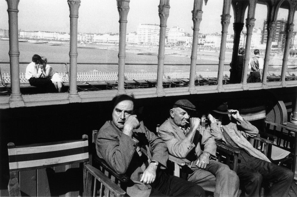 Three elderly males relaxing in chairs, 1968.
