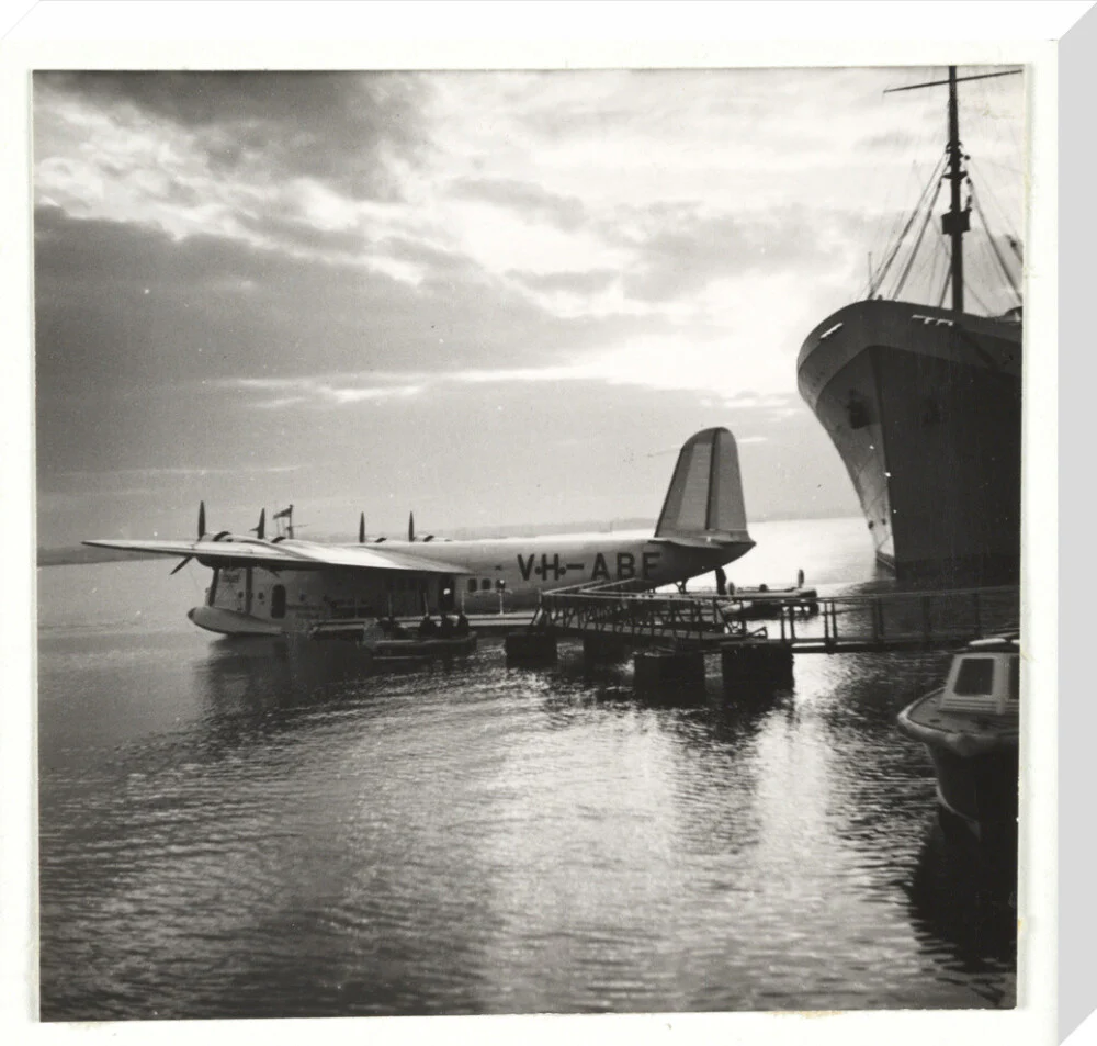 Flying boat moored at a jetty, c 1935. - Image 33