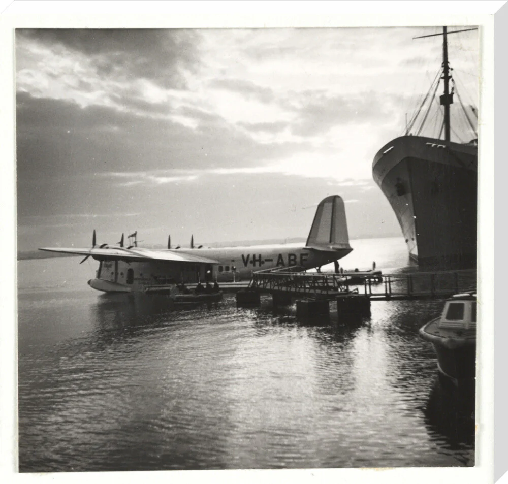 Flying boat moored at a jetty, c 1935. - Image 34