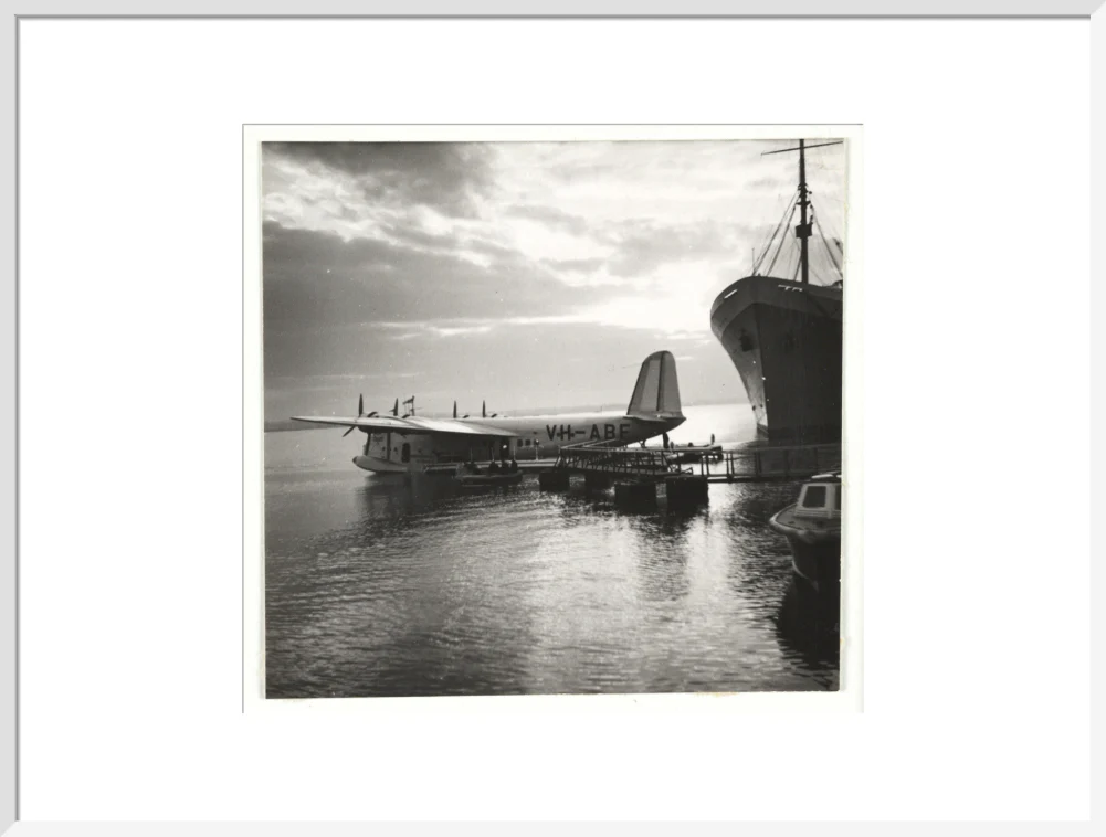 Flying boat moored at a jetty, c 1935. - Image 57