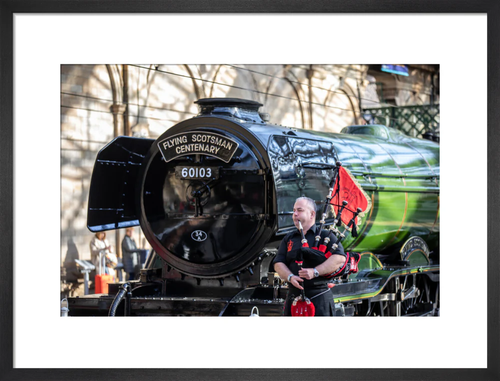Kevin MacDonald from the Red Hot Chilli Pipers beside Flying Scotsman. - Image 13