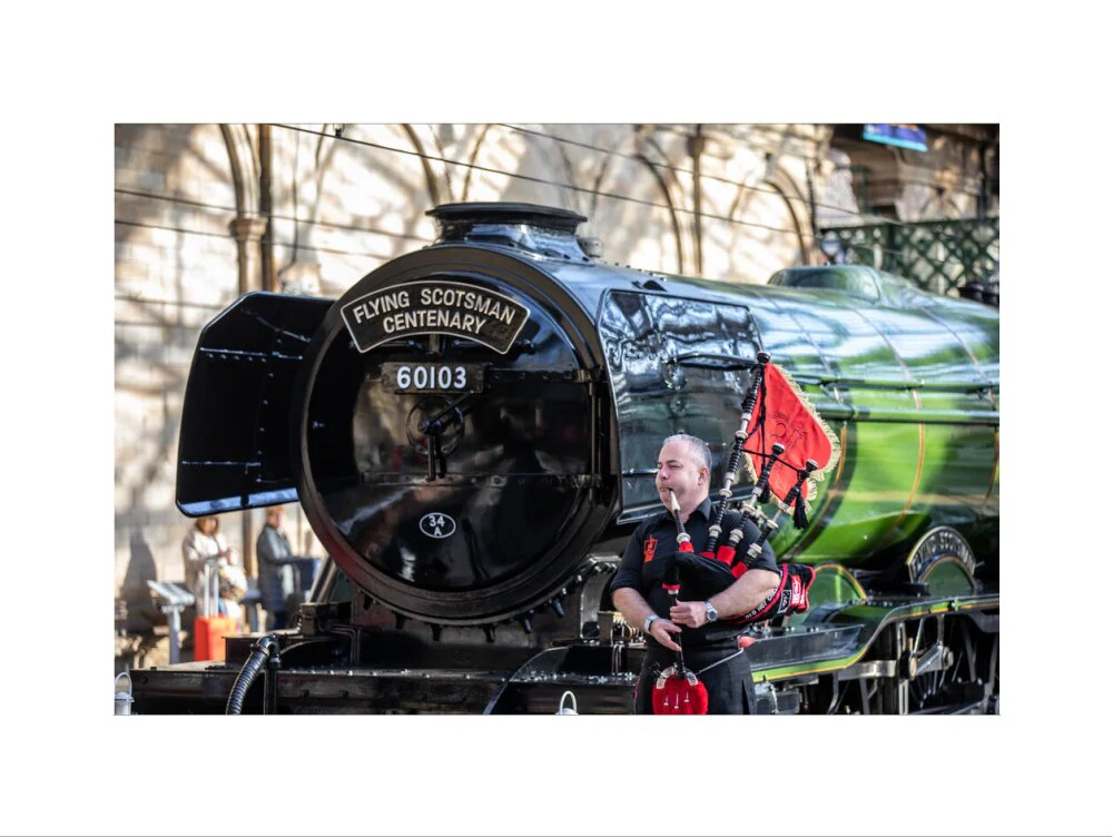 Kevin MacDonald from the Red Hot Chilli Pipers beside Flying Scotsman. - Image 50