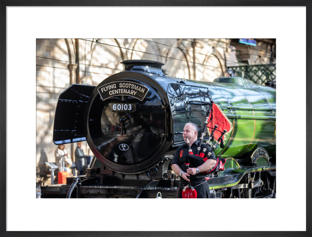 Kevin MacDonald from the Red Hot Chilli Pipers beside Flying Scotsman. - Image 51
