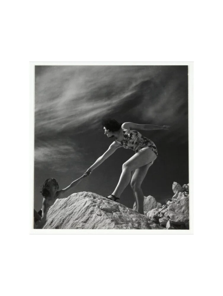 Woman helping child climb onto a rock, about 1935 - Image 55