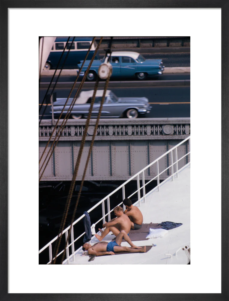 Sunbathers on a bridge, USA - Image 13