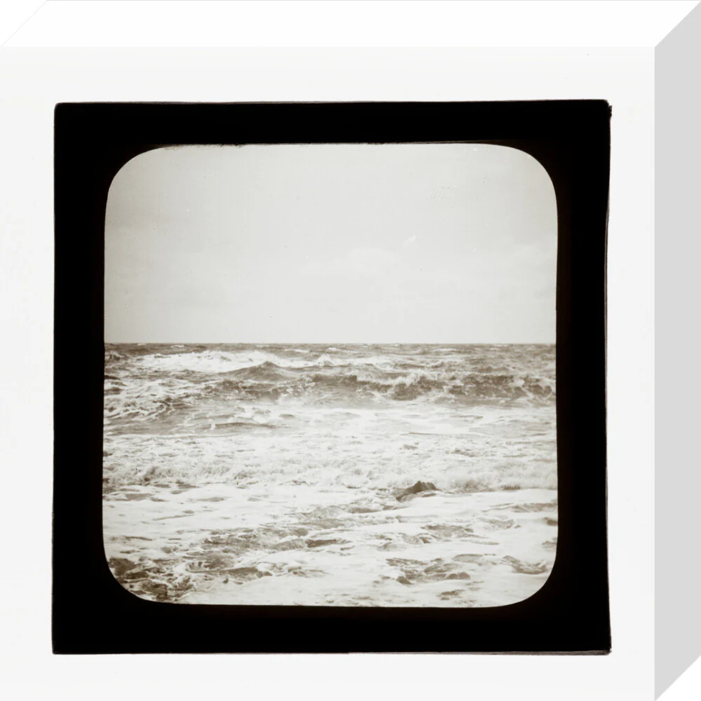 A magic lantern slide of sea waves crashing against the shore by Birt Acres, c. 1893. - Image 26