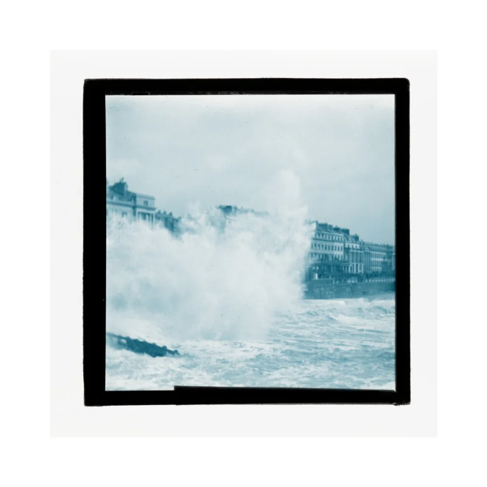 A magic lantern slide of sea waves crashing against the shore by Birt Acres, c. 1893. - Image 40