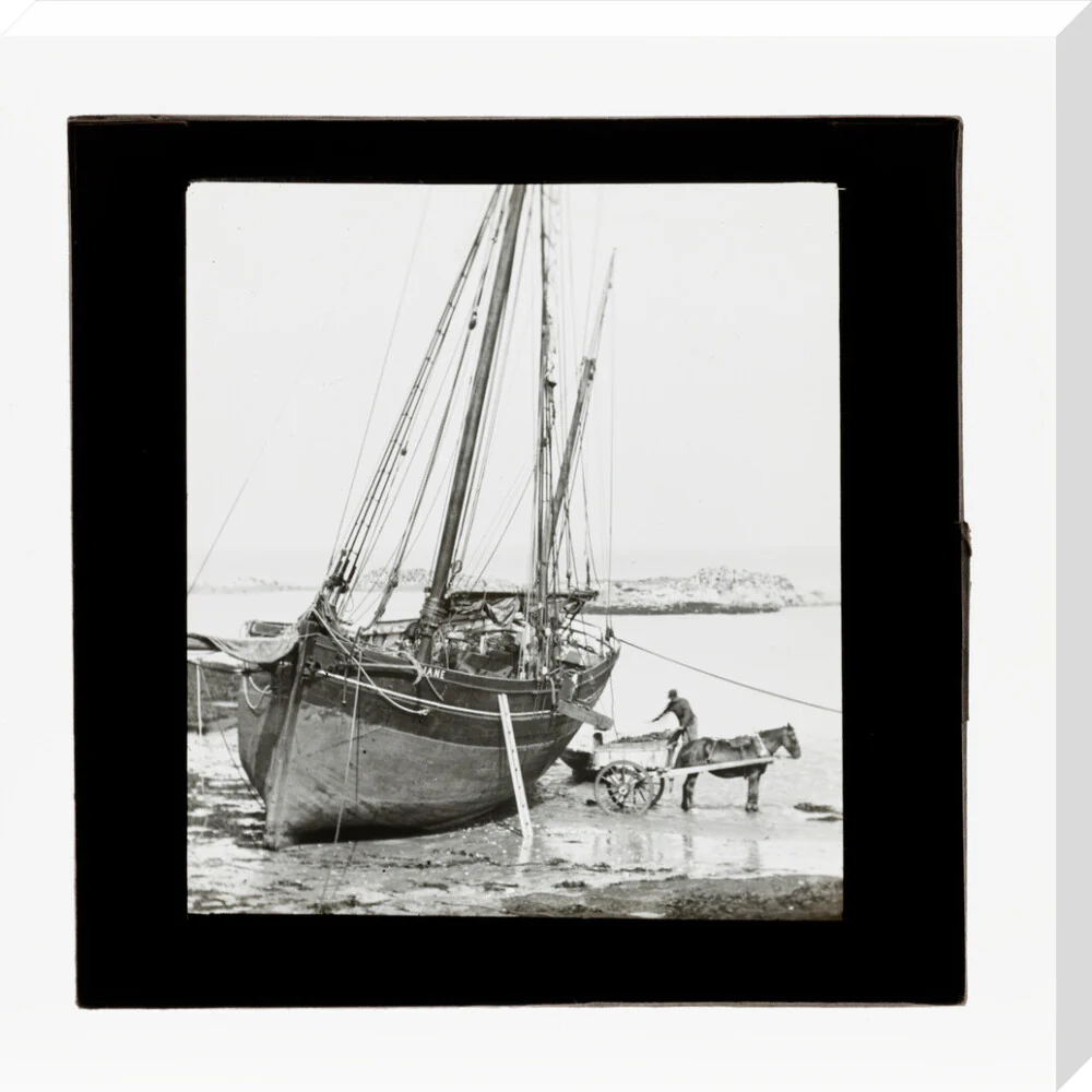 A magic lantern slide of a boat in harbour by Birt Acres, c. 1893. - Image 33