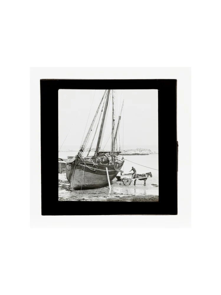 A magic lantern slide of a boat in harbour by Birt Acres, c. 1893. - Image 50