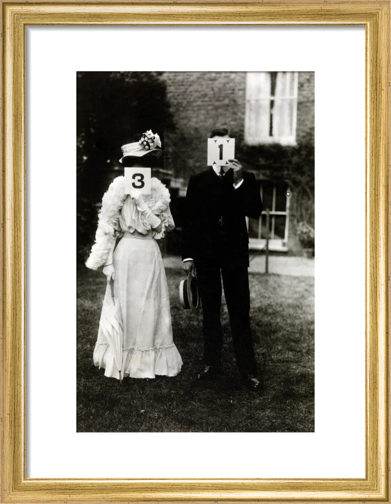A couple, each holding up a number in front of their face circa 1905 - Image 10