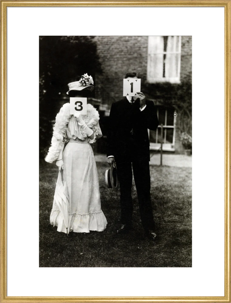 A couple, each holding up a number in front of their face circa 1905 - Image 25