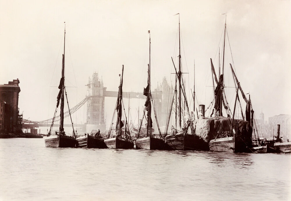 Boats moored at Tower Bridge, 1890s.