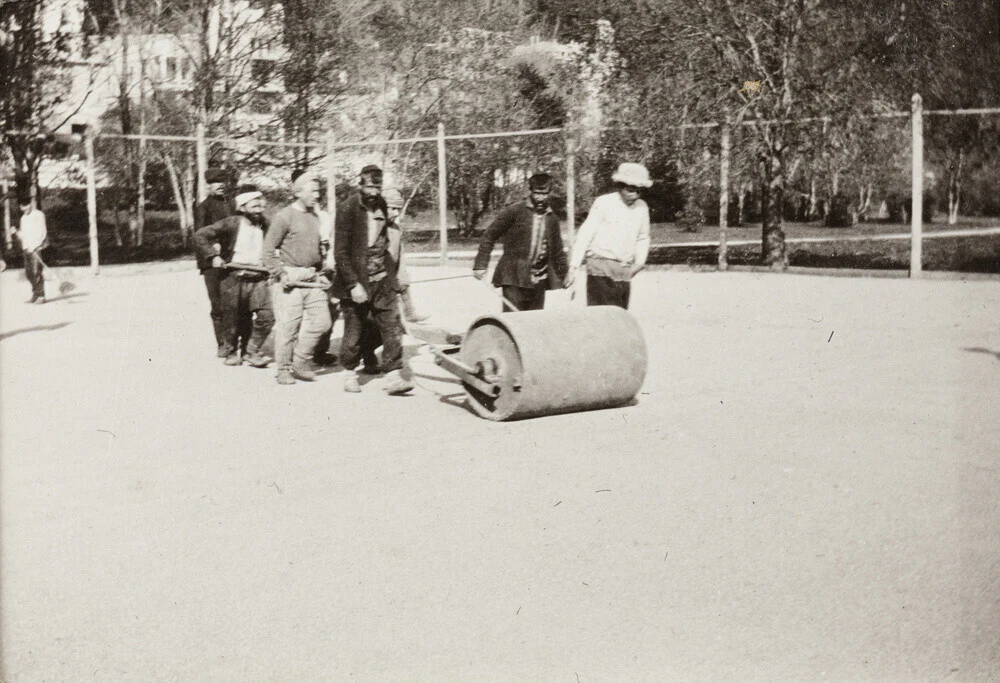 Rolling the Tennis Courts.