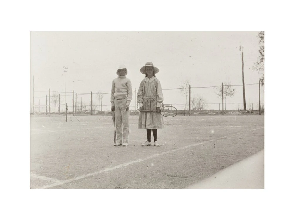 H. H. Prince Nikita Alexandrovitch and Atia Staroselsky on the tennis court, both are holding rackets. - Image 12