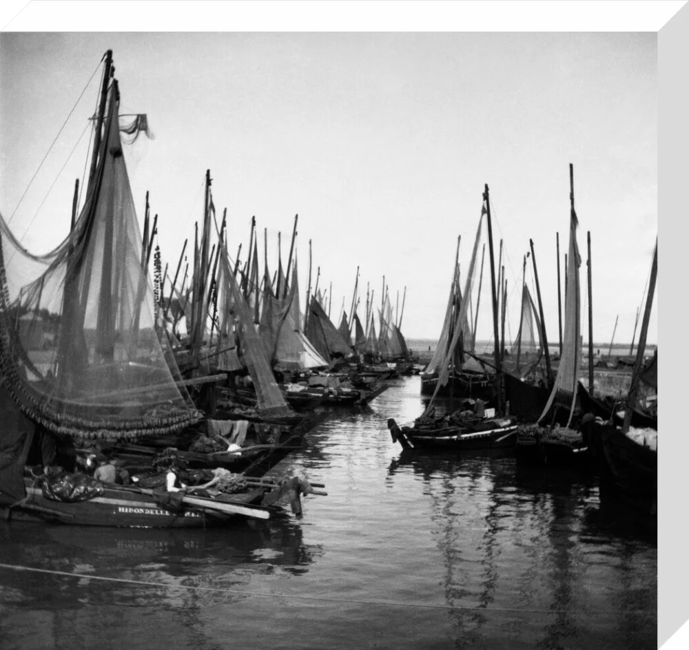 Small fishing boats moored in a harbour, c. 1910. - Image 55